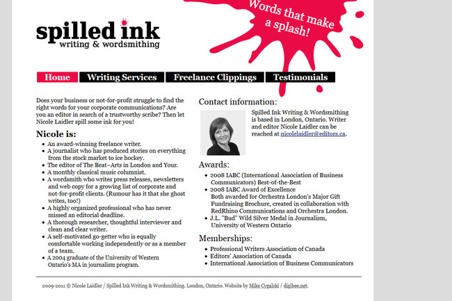 Spilled Ink Writing and Wordsmithing website displayed on an LCD monitor